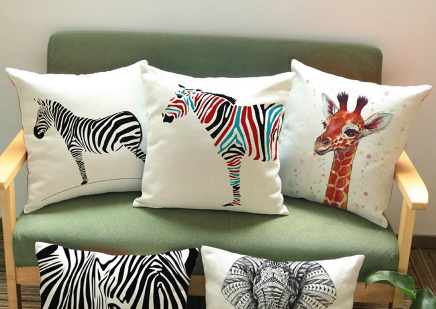 Part of our African homeware range, our animal decorative cushion is a beautiful addition to your home. The white cushion with graphics of zebras, giraffes and elephants, is the perfects sofa cushion and chair cushion.