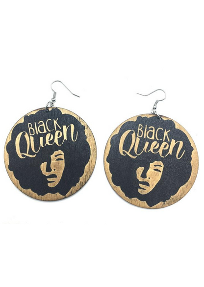 Wooden earrings with a graphic of a woman with an Afro and the words Black Queen emblazoned across the top. 