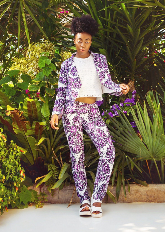 White trousers with a purple African print motif on the top.